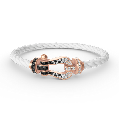 [kincade]FORCE GROSSES HUFEISENARMBAND IN SCHWARZ UND WEISS MIT DIAMANTEN IN ROSÉGOLD